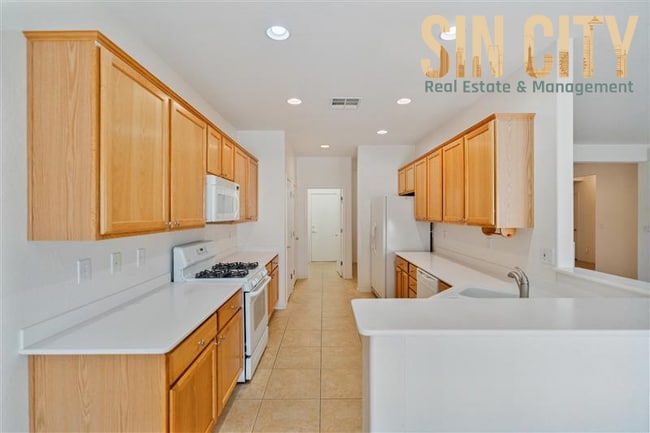 Building Photo - "Charming 3-Bed Haven with 1,718 Sq. Ft. of Comfort in Sun City Aliante!"