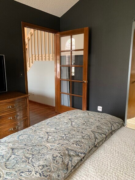 Primary Suite on main level with large tub and shower and small sitting area - 7230 Native Cir