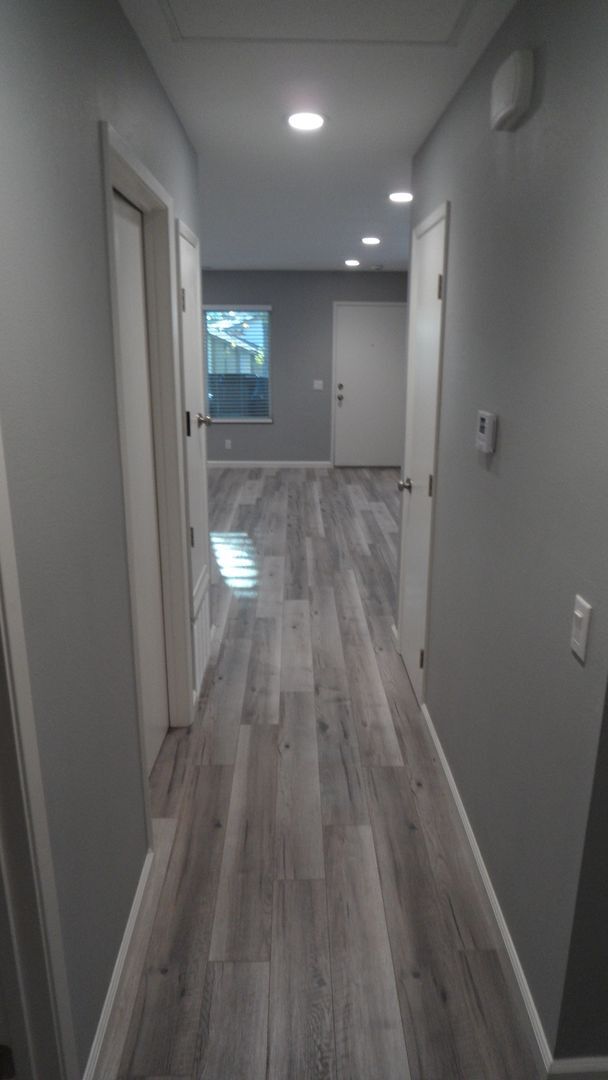 Building Photo - REMODELED 2BR; 1BA end unit condo w/ 1 car garage & 1 parking space