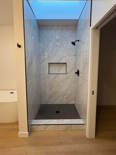 Separate shower with skylight over the shower. - 7834 S Harvard Blvd