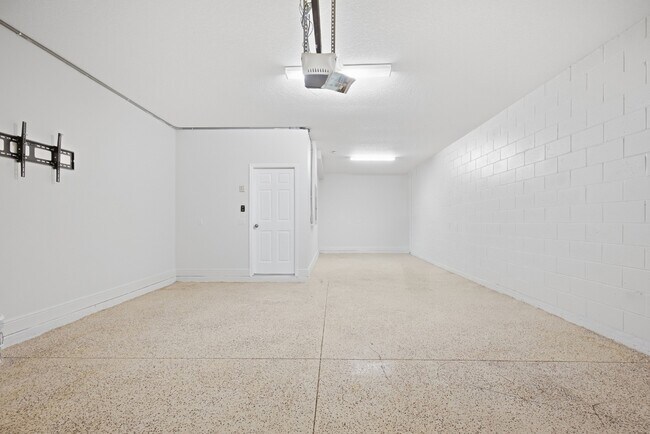Building Photo - Spacious 6-Bedroom Home Near Lake Nona | 3-Car Garage + Tesla Charger