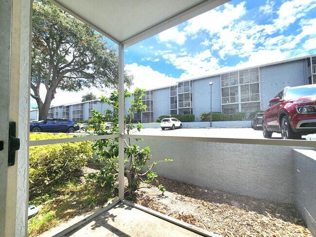 Building Photo - Ground Floor End-Unit; New Paint; All-Tile...