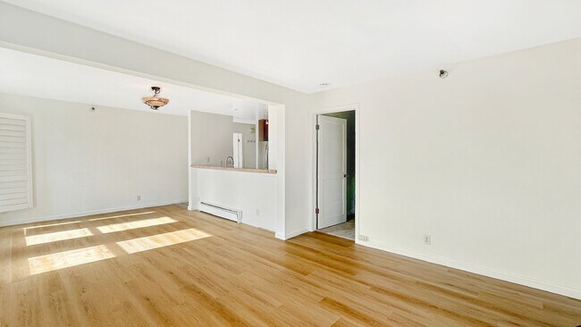 Building Photo - Exceptional Corner Unit w/ Wraparound Sout...