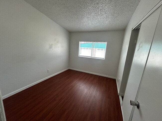 Building Photo - Single story home with large backyard and huge carport with plenty of storage.
