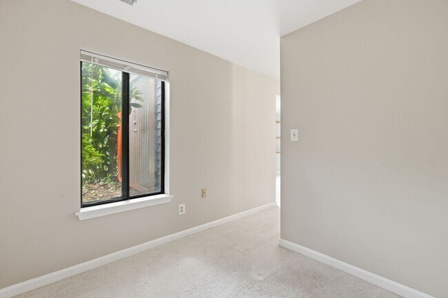Building Photo - Contemporary design meets exceptional space in this inviting ground level residence, offering eff...