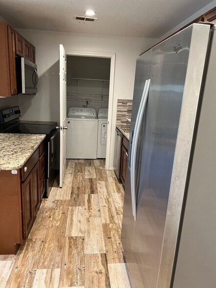 Whirlpool stainless steel refrigerator, granite countertops - 2130 Forest Knoll Dr NE