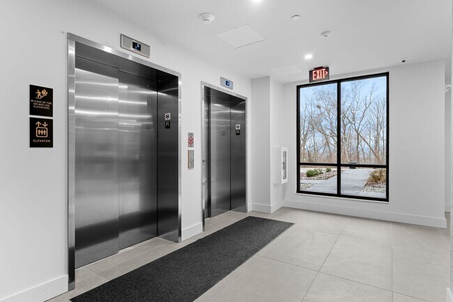 Building Photo - 2 Bedroom Corner-Unit with Wooded Balcony ...