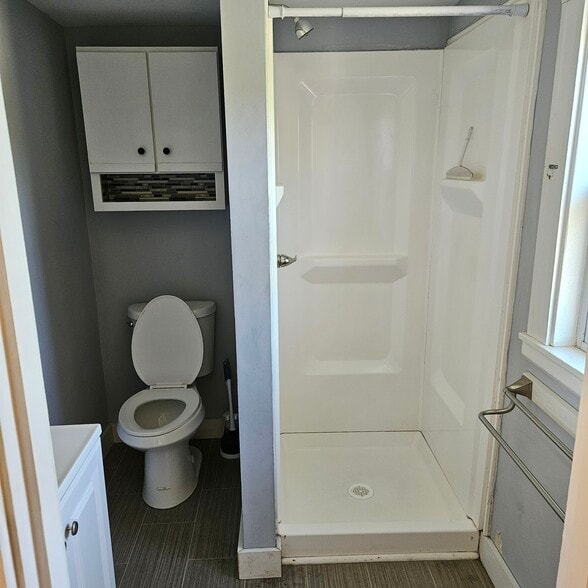 Bathroom shower, no tub. The only bathroom is upstairs - 1011 Main St