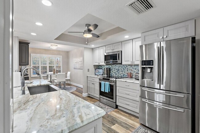 Building Photo - Two Bedroom/Two and a half bath gated townhome.