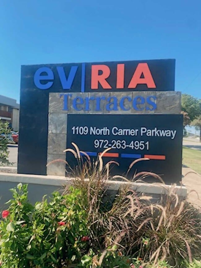 Community entrance sign at evRIA Terraces, located at 1109 North Carrier Parkway, Grand Prairie, TX - Evria Terraces (NEW) Apartments