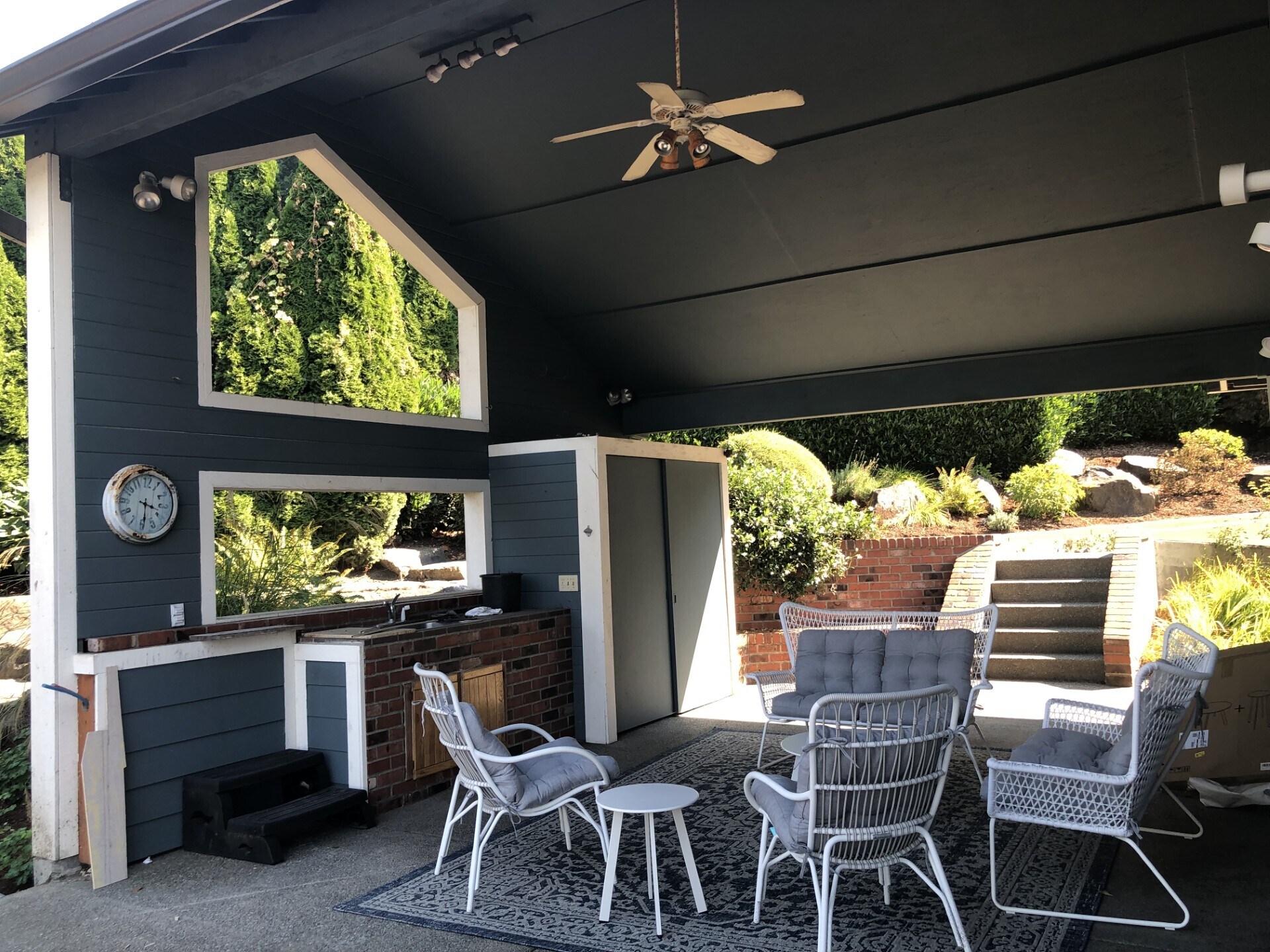 Covered patio with seating - 7107 120th St NW