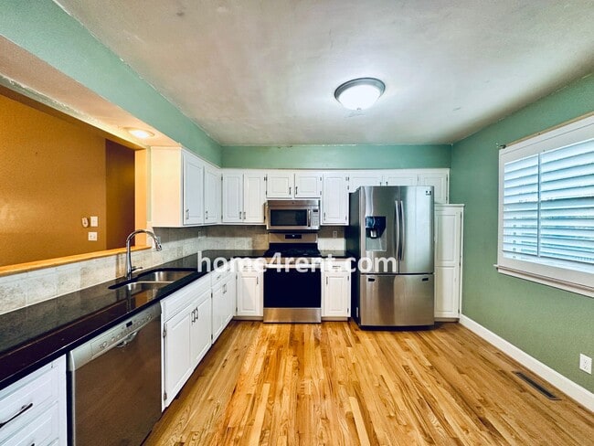 Building Photo - A Lovely, Four Bedroom Lenexa Home w/ Wood...