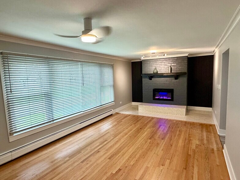 New 1.5” gray blinds, refinished wood floors, lights & fan. Nice LV sliding barn door (pictured sep) - 771 56th St