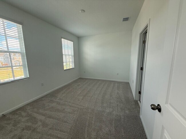Building Photo - Brand new construction 3 Bedroom Town Home in Island Village of Celebration