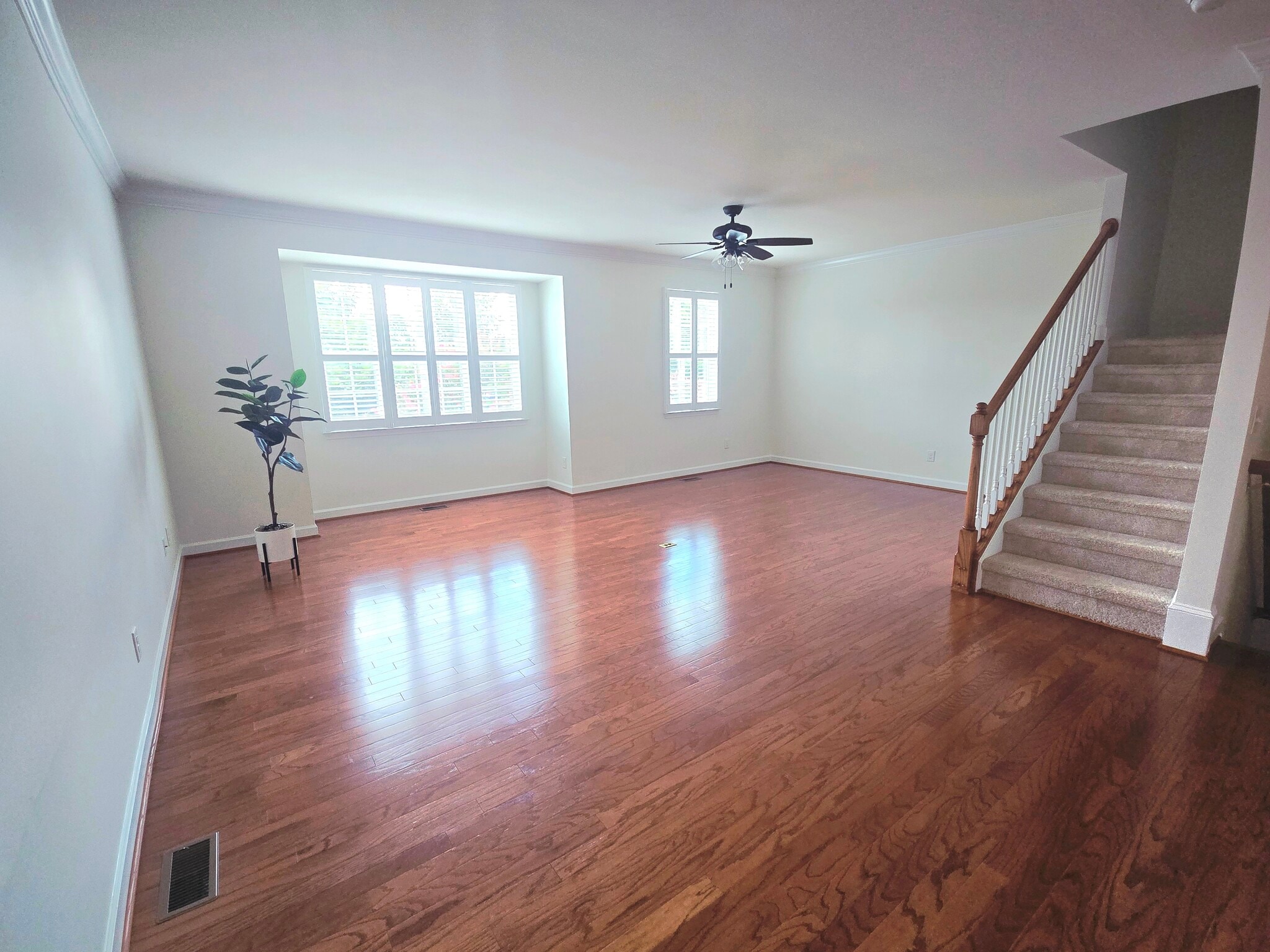 Living room with hardwood floors and plantation shutters - 1207 Heritage Links Dr