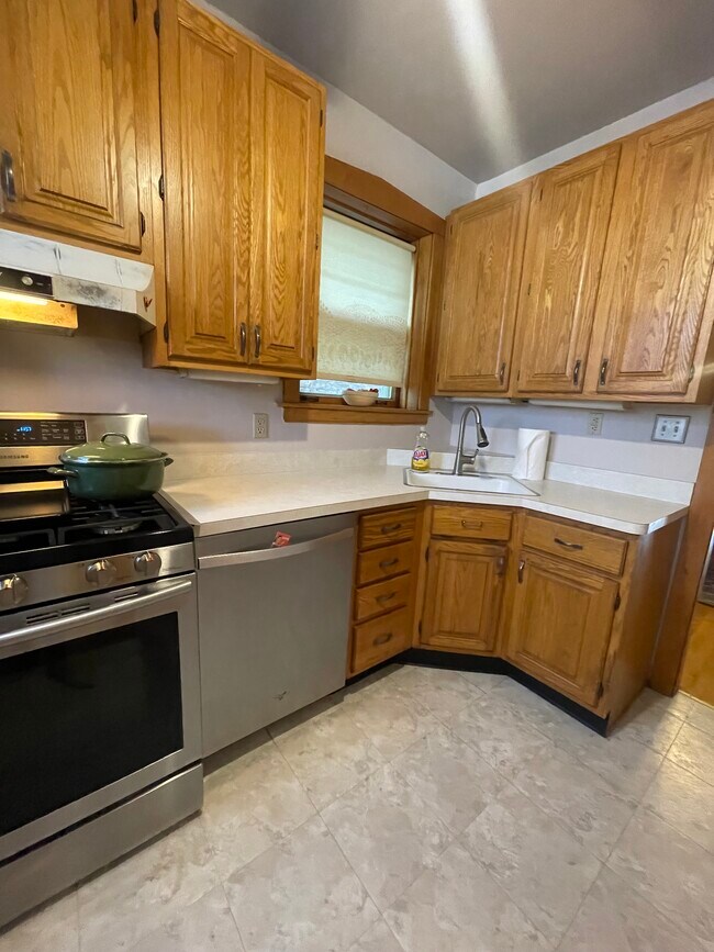 Kitchen with stainless steel appliances - 5735 N Washtenaw Ave