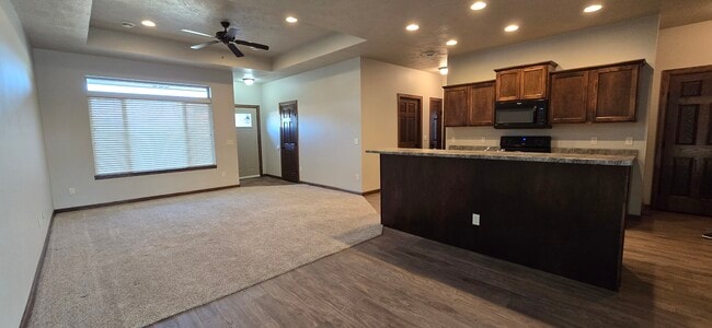 Open concept, View from dining area, Picture window on left looks out to front yard. - 3511 E Bison Trl