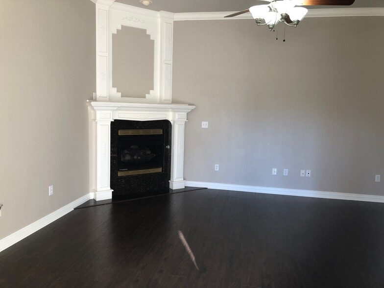 Living room with gas fireplace - 6188 W Milliken Bnd