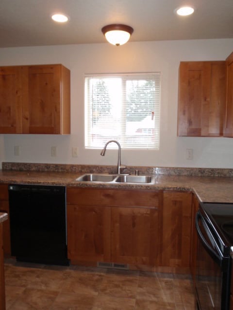 Building Photo - Newer house with attached garage. Half mon...