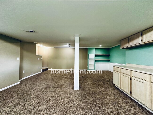 Building Photo - Blue Valley Schools w/ Wood Floors, Finished Basement and a Peaceful, Private Fenced Yard!