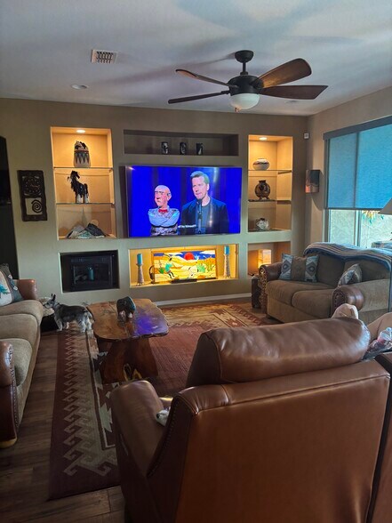 Living room with 75” tv - 4518 N Petersburg Dr