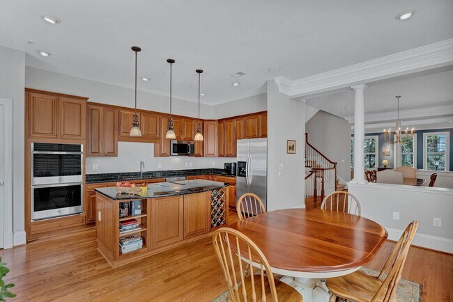 Building Photo - Stunning 4BR All-Brick End-Unit Townhome with Rooftop Terrace in Potomac Greens