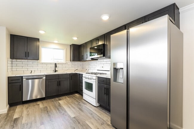 Building Photo - Bright & Fully Renovated 3BR Home with Backyard, Bonus Attic Space & Modern Upgrades