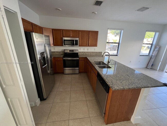 Building Photo - 9399 W 33rd Ln