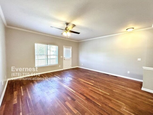 Building Photo - Spacious 4-Bedroom Townhome with Modern Co...