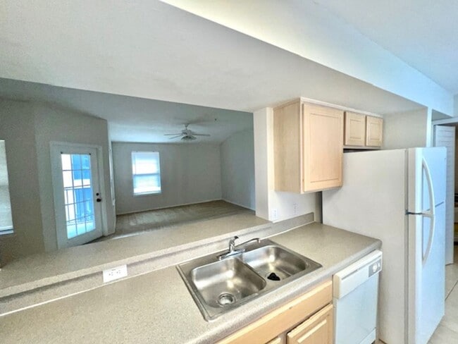 Building Photo - Move in NOW- Spacious 2 bedroom 1 bath condo on 3rd floor in gated community! Water included with...