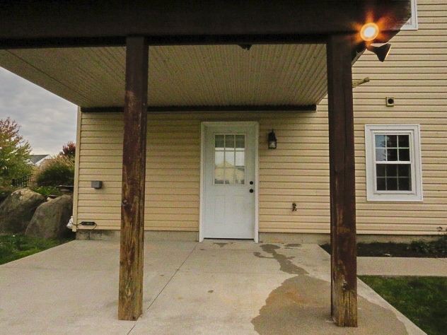 Covered patio right next to a beautiful pond with water feature. - 365 Lynne Dr