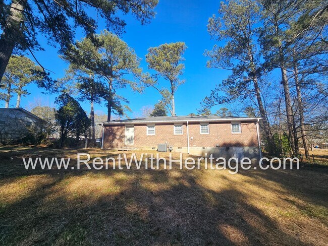 Building Photo - Great Brick Ranch / Harwood Floors / Huge Shop or Extra Storage / No Garage / Great Private Back ...