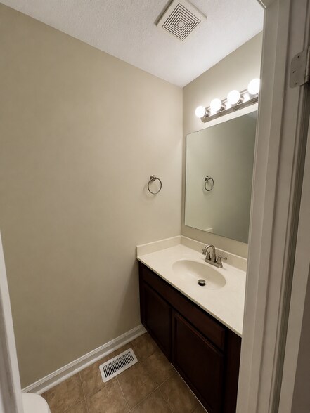 Half bath downstairs. - 5484 Pine Top Cir