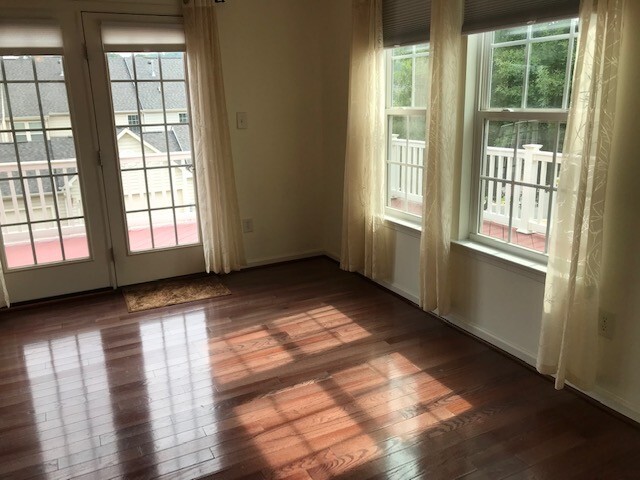 Family room view leading to wrap around deck - windows all aroung - 1944 Asheville Dr