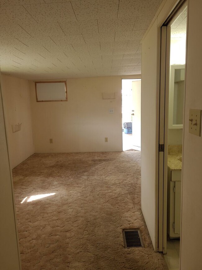Building Photo - 55+ mobile home community. On canal to bea...
