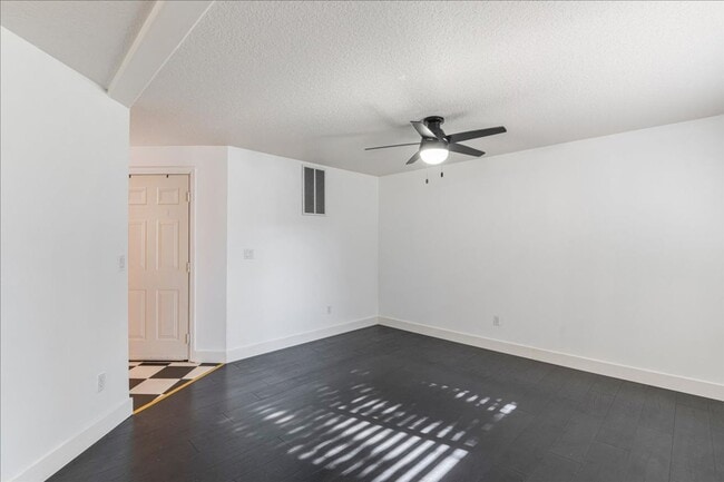 Building Photo - Versatile 4-Bedroom Corner Condo with Main...