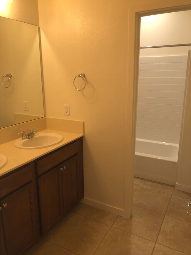 Building Photo - CORNER LOT - END UNIT - NO YARD TO MAINTAIN - GRANITE - STAINLESS - GATED