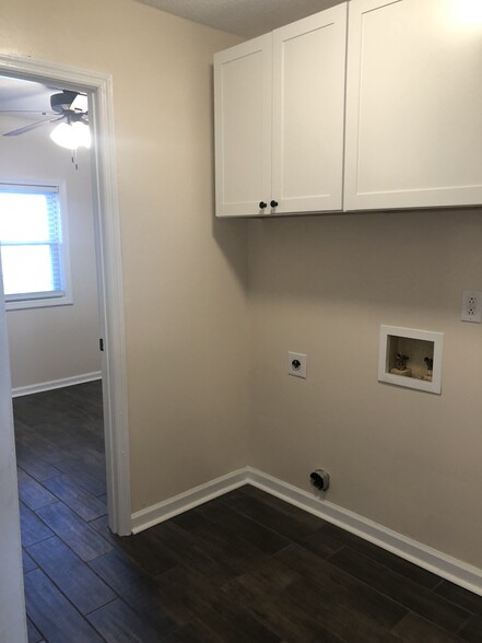 Laundry hook ups are located in the hallway. New cabinets added for additional storage. - 357 E Main St