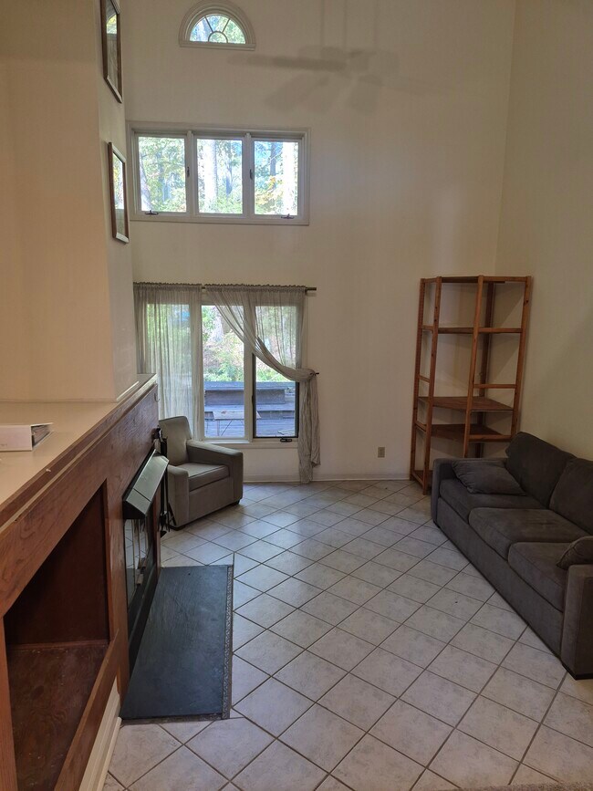 living room with wood fireplace - 4422 Beechnut Ln