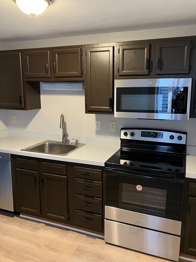 Building Photo - Comfortable, All-New Liverpool TownHome