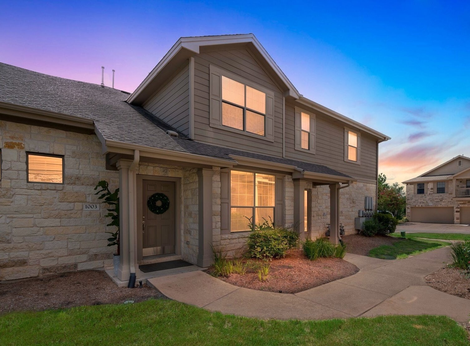 Entrance at dusk - 9201 Brodie Ln