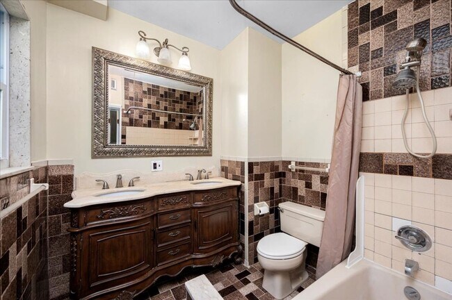 Building Photo - Elegant Multi-Level Brick Residence with Outdoor Oasis