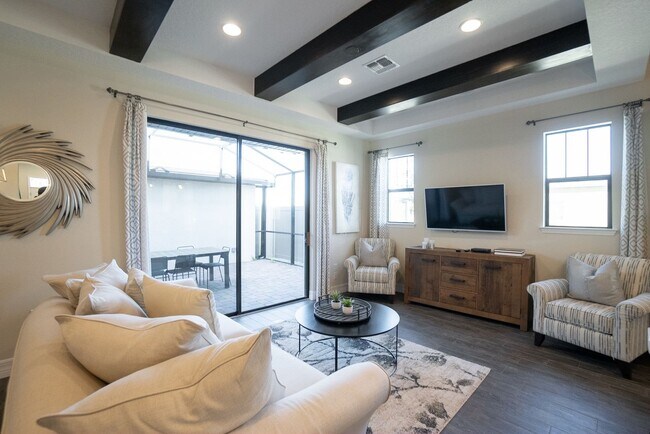 Building Photo - 3/2.5 Beautiful Model Townhome with Screened Courtyard & 2 Car Garage