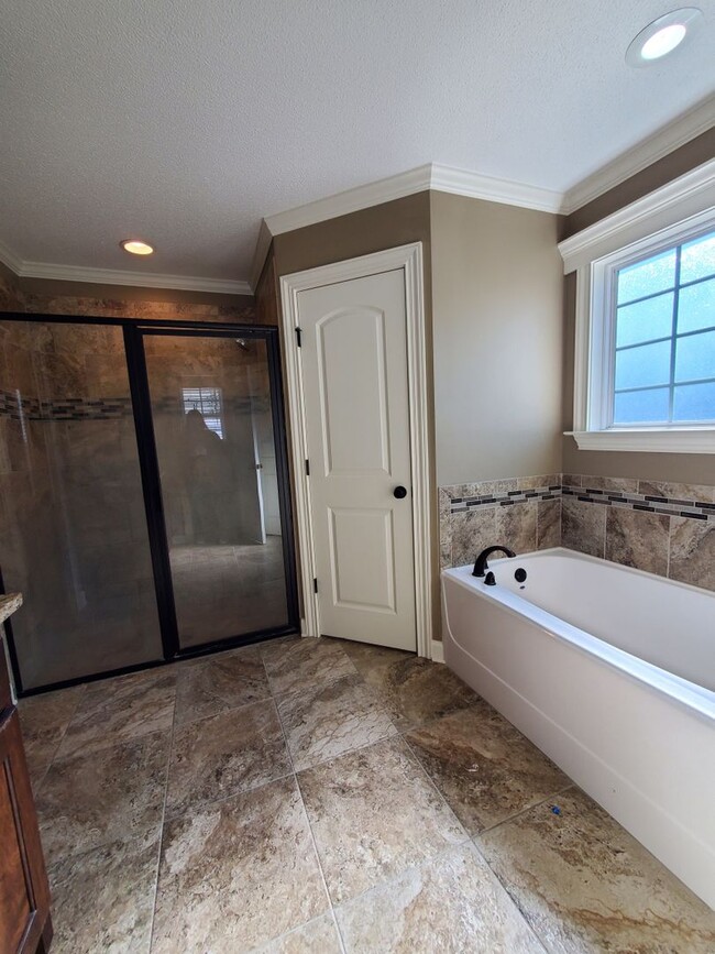 Building Photo - Spacious 4-Bedroom Home with Open Layout, Granite Finishes & Fenced Yard