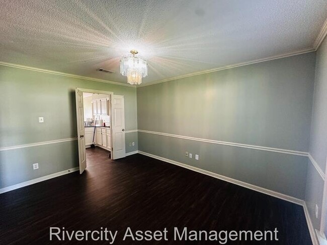 Building Photo - charming three-bedroom, two-full-bath resi...