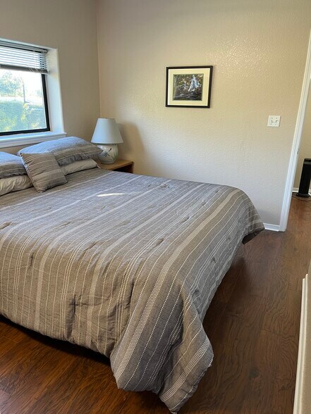 king-size bed in 1st bedroom - 4569 E Alamos Ave