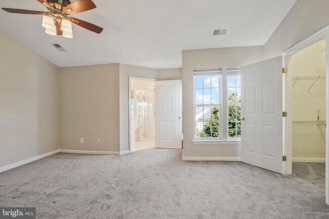 Building Photo - This beautifully maintained brick-front, three-level townhome is located in a highly sought-after...