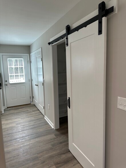 Washer/dryer, pantry area, and rear entry door to spacious back deck - 2225 Kenwood Blvd SE