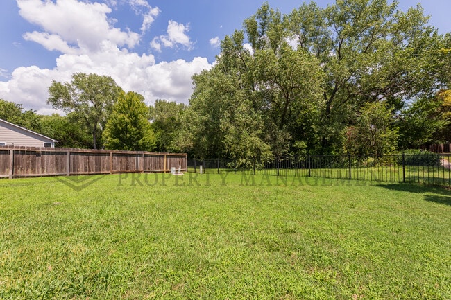 Building Photo - 6534 E 39th Ct N