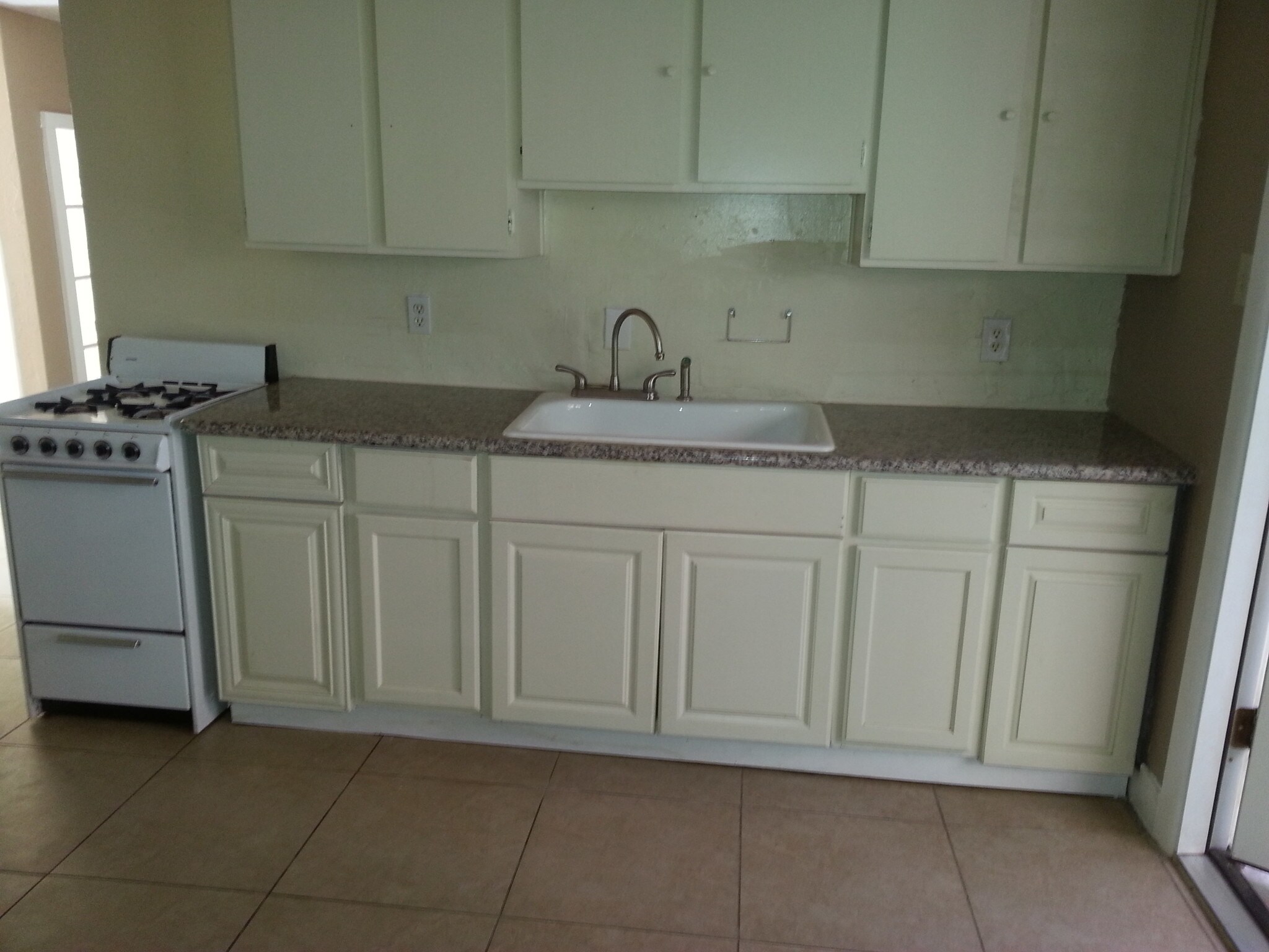 Open kitchen - with door to back yard - 2138 E Turney Ave